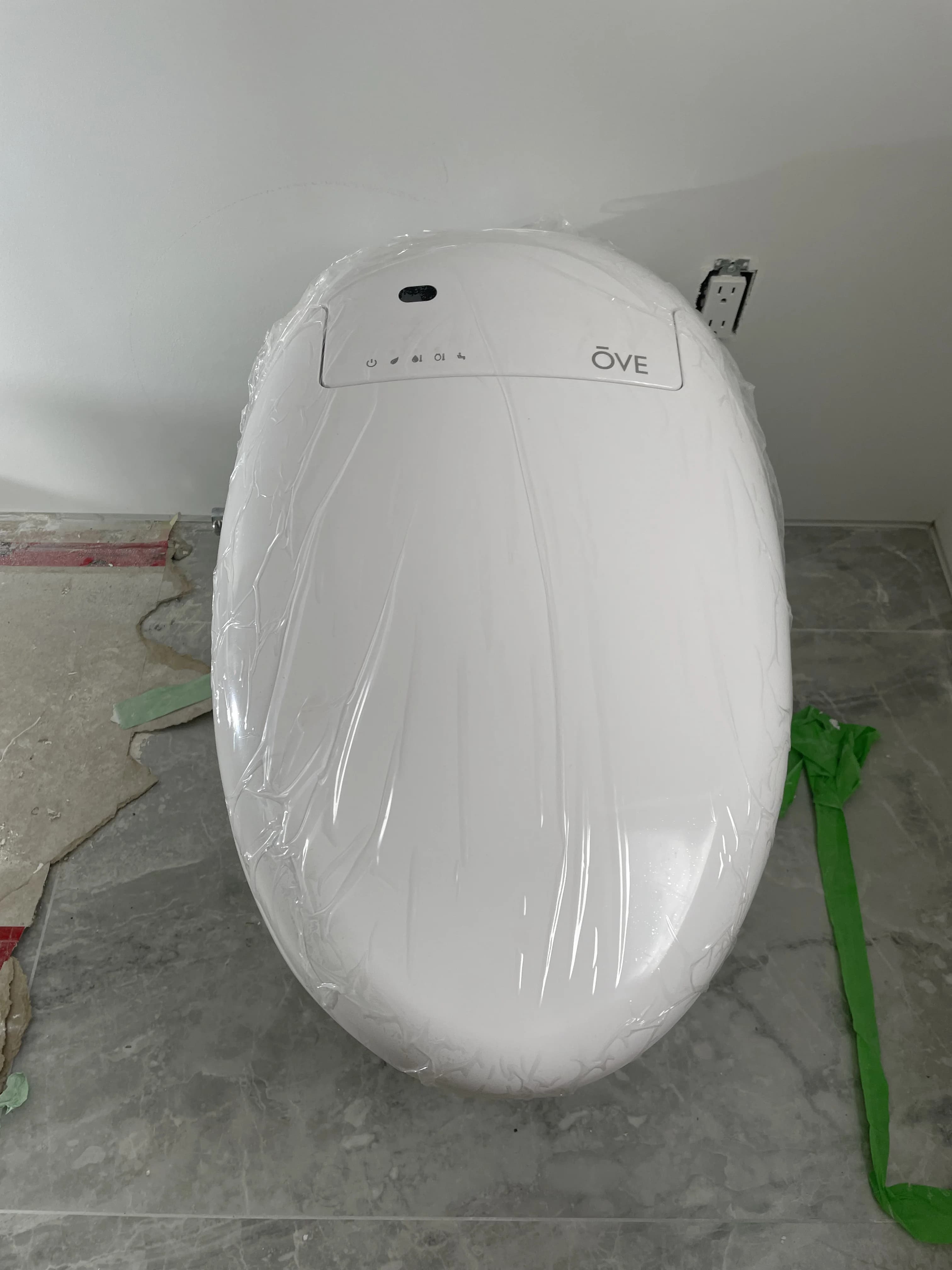 Smart toilet installation in Ajax with power wiring and water supply before final trim