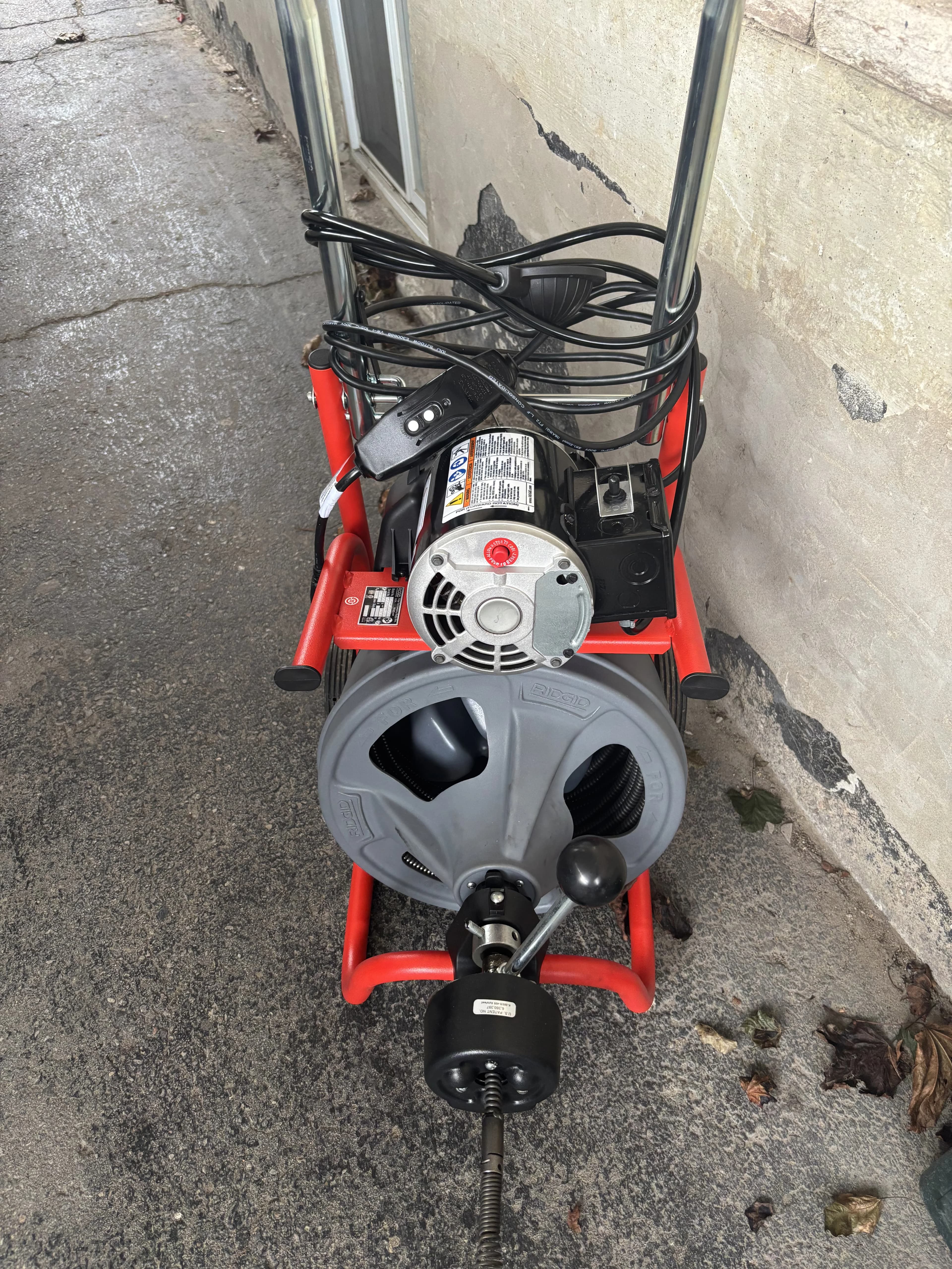 Portable drum machine drain auger equipment used for a stubborn clog in Ajax