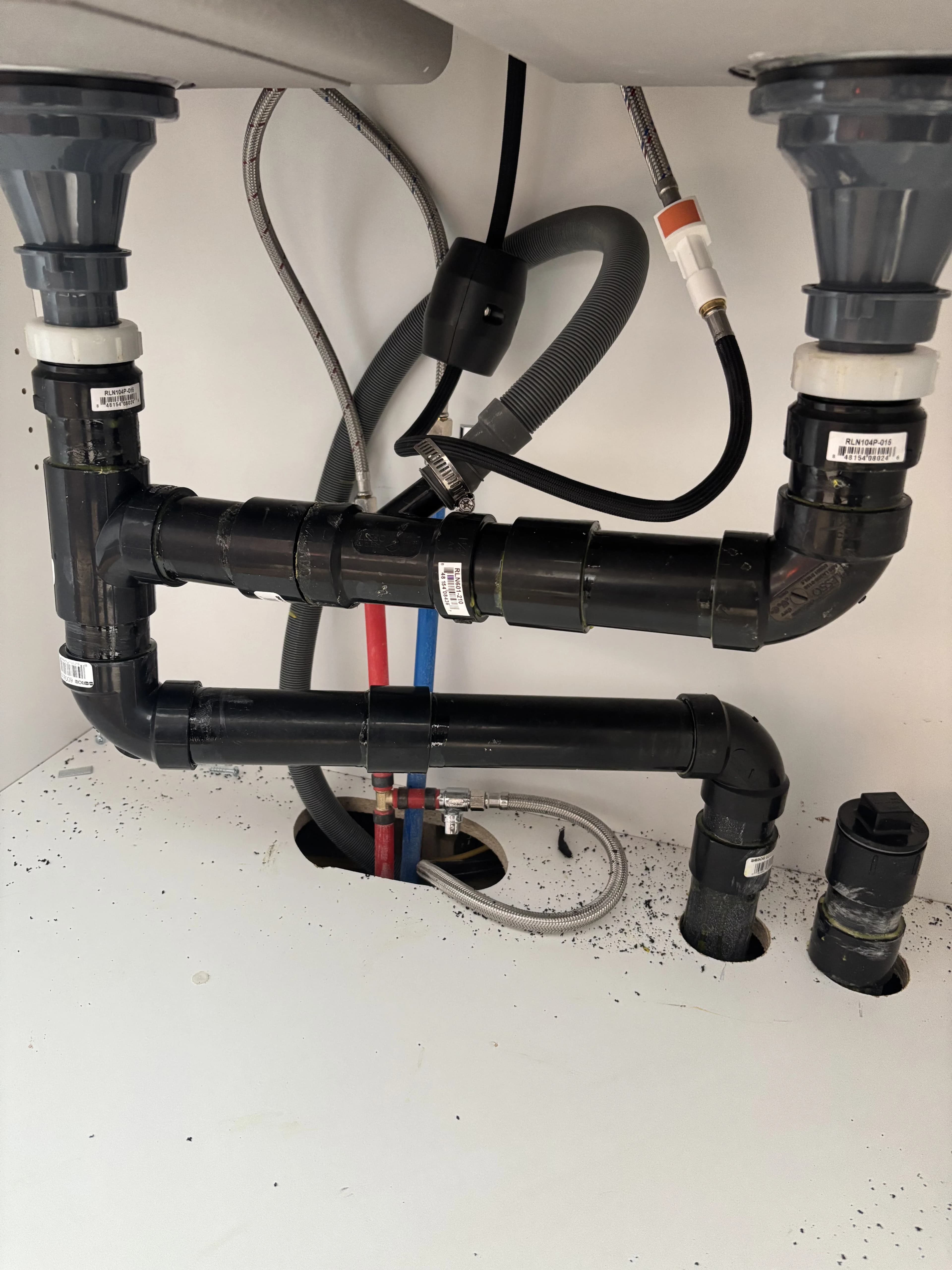 Kitchen sink drain and PEX supply lines during drain cleaning service in Ajax